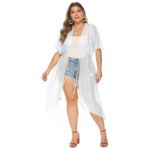 Detail of waist tie and lightweight chiffon fabric on a white beach cover-up cardigan