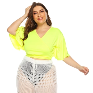 Neon green V-neck wrap top with short batwing sleeves and matching crochet pants set
