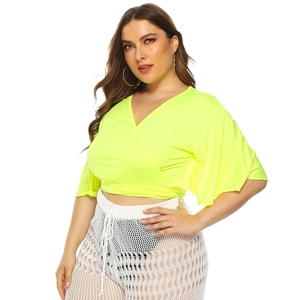 Neon yellow plus size V-neck wrap top with batwing sleeves for a summer vacation look