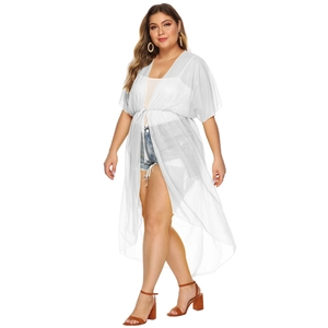 Detail of plus size white chiffon cover-up featuring waist tie and irregular hemline