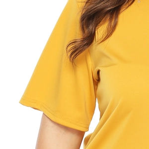 Close-up of mustard yellow t-shirt sleeve showing premium double-stitched reinforced hem