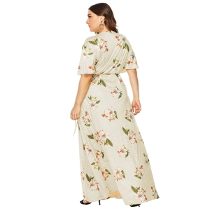 Back view of plus size maxi dress with white lily flower and polka dot prints