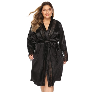 Close-up of black satin robe featuring delicate lace trim on sleeves and a silky V-neckline
