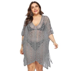 Close-up of the intricate grey crochet pattern and V-neckline on this plus size beach cover-up