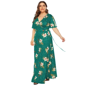 Detail of dark green V-neck maxi dress with white floral print and waist tie
