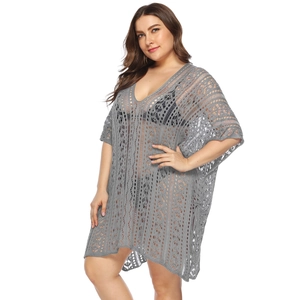 Detail of grey hollow-out crochet beach cover-up featuring geometric knit patterns