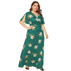 Plus size deep V-neck wrap maxi dress with white lily flower print and flutter sleeves