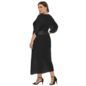 Detail of plus size black beach cover-up showing semi-transparent crepe fabric and lace belt