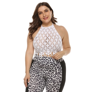Close-up of white crochet halter top with tassel fringe and leopard print pants