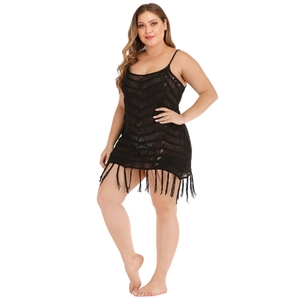 Plus size black crochet knit mini dress with tassel hem and see-through wave pattern