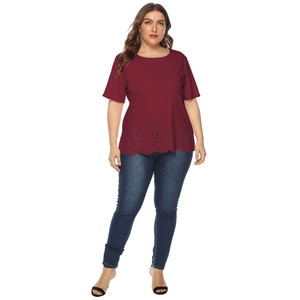 Detail of plus size wine red T-shirt showing laser-cut floral hollow-out hem design