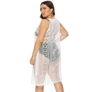 White crochet sleeveless beach cover-up with intricate geometric openwork patterns