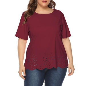 Detail showing laser-cut floral pattern and scalloped hem on plus size burgundy t-shirt