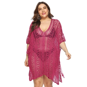 Detail of rose red crochet knit texture and side slit lace-up on beach cover-up dress
