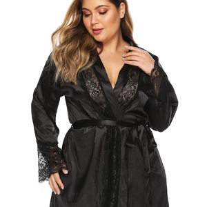 Close-up of black satin robe with delicate floral lace trim on sleeves and neckline