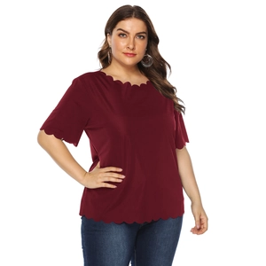 Detail view of scalloped wavy edges on a burgundy plus size round neck short sleeve t-shirt