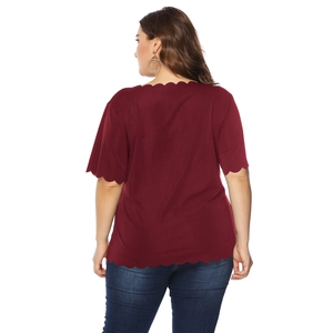 Detailed back view of burgundy plus size top with scalloped edges and short sleeves