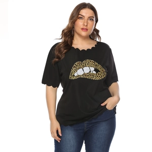 Detail of scalloped neckline and leopard lip print on a black plus size T-shirt