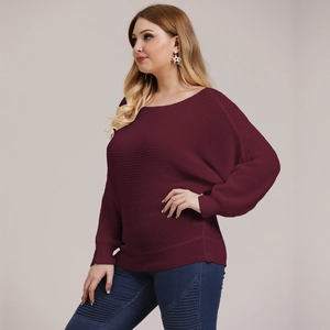 Detailed texture of burgundy ribbed knit oversized sweater with drop shoulder design