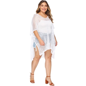 Detail of white hollow-out crochet knit beach cover-up with side split and batwing sleeves