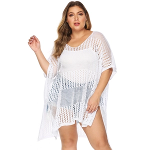 Detail of white crochet hollow knit beach cover-up with V-neck and batwing sleeves