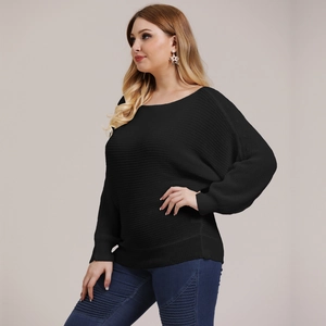 Detailed view of women's black knit sweater with ribbed cuffs and round neckline
