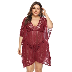 Close-up of crochet hollow-out texture on plus-size burgundy V-neck beach cover-up