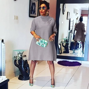 Elegant grey pleated A-line dress for women featuring chic 3/4 sleeves and a round neck design