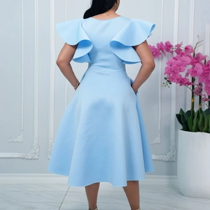 Detail view of the ruffle sleeve design on this elegant light blue waist-tie dress