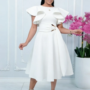 Detail of elegant white dress featuring ruffled sleeves and waist belt with metallic buckle