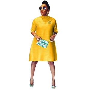 Elegant ginger yellow pleated A-line midi dress with half sleeves and a chic mock neck