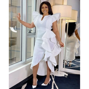 Detail of elegant white V-neck dress featuring ruffled sleeves and asymmetrical hemline