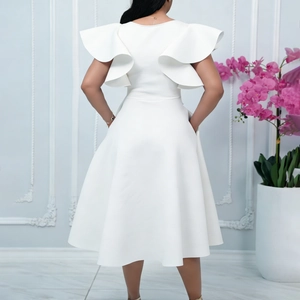 Elegant white mid-length dress featuring layered ruffle sleeves and a sleek back silhouette