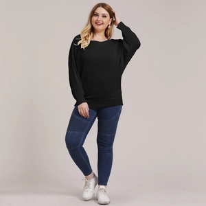 Women's plus size black crewneck batwing sleeve sweater and pleated biker jeans