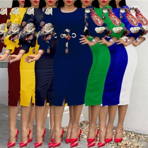 Detail view of V-neck floral midi dresses with puff sleeves and metal chain waist decoration