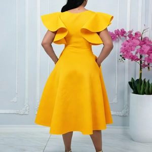Back view of elegant bright yellow dress with ruffle sleeves and wide flare skirt