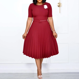 Elegant burgundy short sleeve pleated midi dress with a waist belt and floral brooch detail