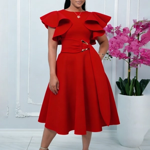 Detail of red elegant dress featuring ruffle sleeves and a waist belt with gold buckle