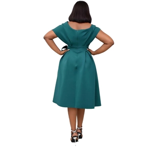 Back view of dark green A-line dress with waist tie and zipper closure detail