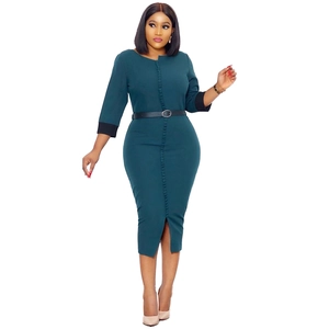 Detailed view of dark green midi dress featuring button front and black contrast sleeves