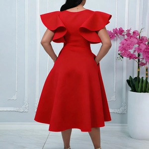 Rear view detail of elegant red dress featuring ruffled cap sleeves and cinched waist