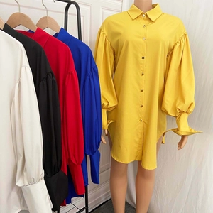 Detail view of the elegant lantern sleeves and button cuffs on this solid shirt dress