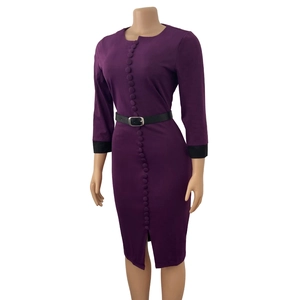 Detail view of purple long sleeve dress featuring vertical buttons and black contrast cuffs