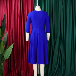 Rear view of a royal blue midi dress with a zipper back and elegant flared hemline