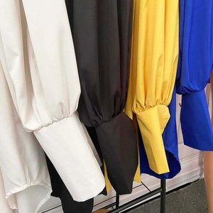Detailed comparison of long puff sleeves with tight cuffs in white, black, yellow and blue