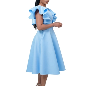 Detail view of the sky blue dress featuring layered ruffle sleeves and A-line waist