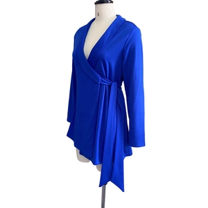 Detail of royal blue wrap top with side bow tie and deep V-neck on a mannequin