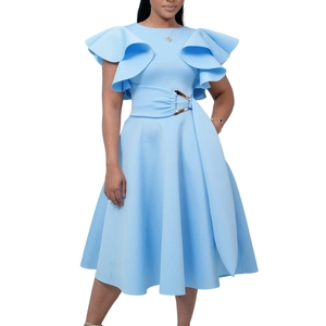 Detail of elegant light blue dress with tiered ruffle sleeves and gold waist buckle ornament
