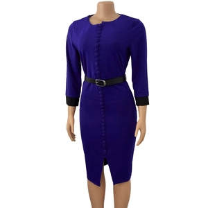 Detail of purple dress featuring row buttons, black cuffs and matching waist belt