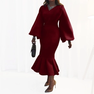 Detailed side view of elegant burgundy V-neck dress with puffy sleeves and mermaid hemline